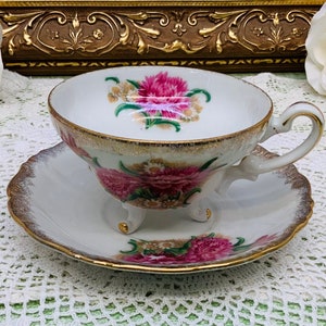 Japan footed hand painted teacup and saucer 1950’s.