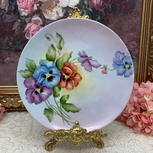 Gorgeous artist signed hand painted Pansy  plate circa 1988.