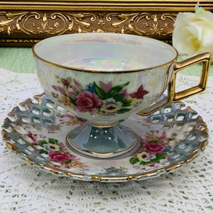 Japan pedestal hand painted teacup and saucer 1950’s.