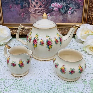 Sadler teapot with cream and sugar.