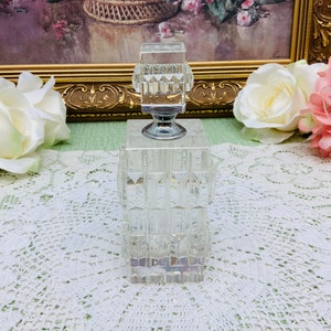 Vintage pressed glass perfume bottle.