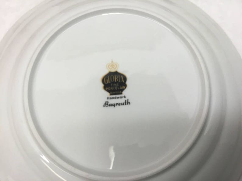Fine porcelain dessert plate with handle.