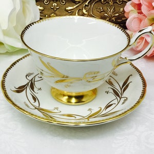 Royal Chelsea &quot;Golden Rush&quot; teacup and saucer.