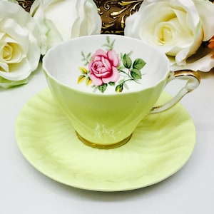 Bone china teacup and saucer in sunny yellow.