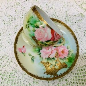 Hand painted Nippon teacup and saucer.