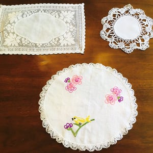 Three vintage hand made doilies.