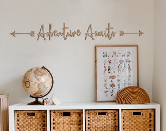 Adventure Awaits wooden wall quote with arrows