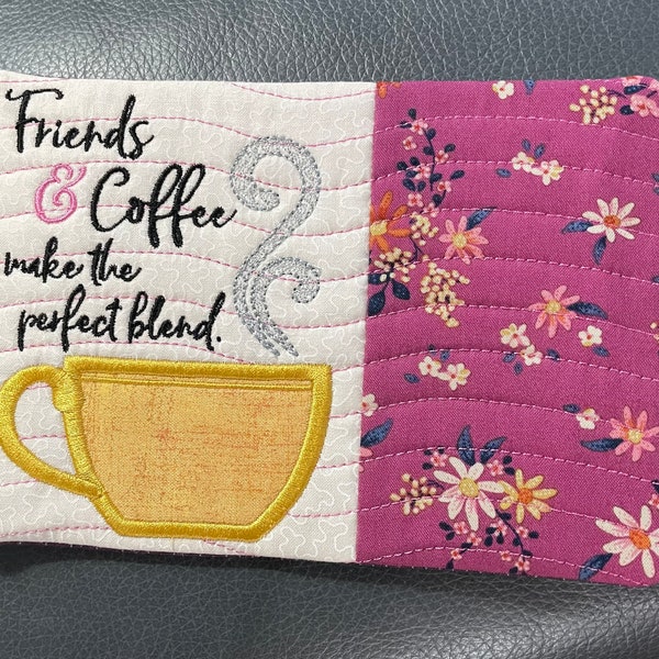 Embroidered mug rug or snack mat with coffee cup.