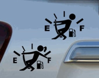 May include: Two black and white car decals of a stick figure pushing a gas pump. The decals are shaped like a gas gauge with the letters E and F on either side.