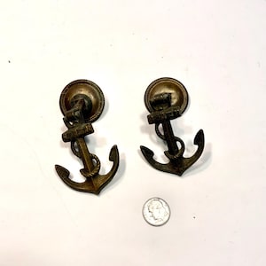 May include: A set of three ceramic mugs with a speckled, matte finish. The mugs are in shades of cream, light gray, and dark gray. Each mug has a simple, minimalist design, perfect for coffee or tea.