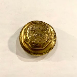Hanes Brass Hubcap, “America’s First Car”, Ca: 1910.