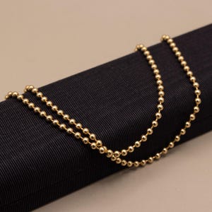 May include: A set of three ceramic mugs with a speckled, matte finish. The mugs are in shades of cream, light gray, and dark gray. Each mug has a simple, minimalist design, perfect for coffee or tea.