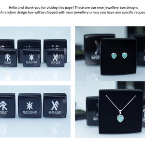 Puede incluir: Cajas de joyer&iacute;a negras con texto blanco que dice "ENERGY", "PROTECTION" y "GOOD LUCK". La imagen tambi&eacute;n muestra un par de pendientes en forma de coraz&oacute;n turquesa y un collar de plata con un colgante de coraz&oacute;n turquesa. El texto dice "&iexcl;Hola y gracias por visitar esta p&aacute;gina!"