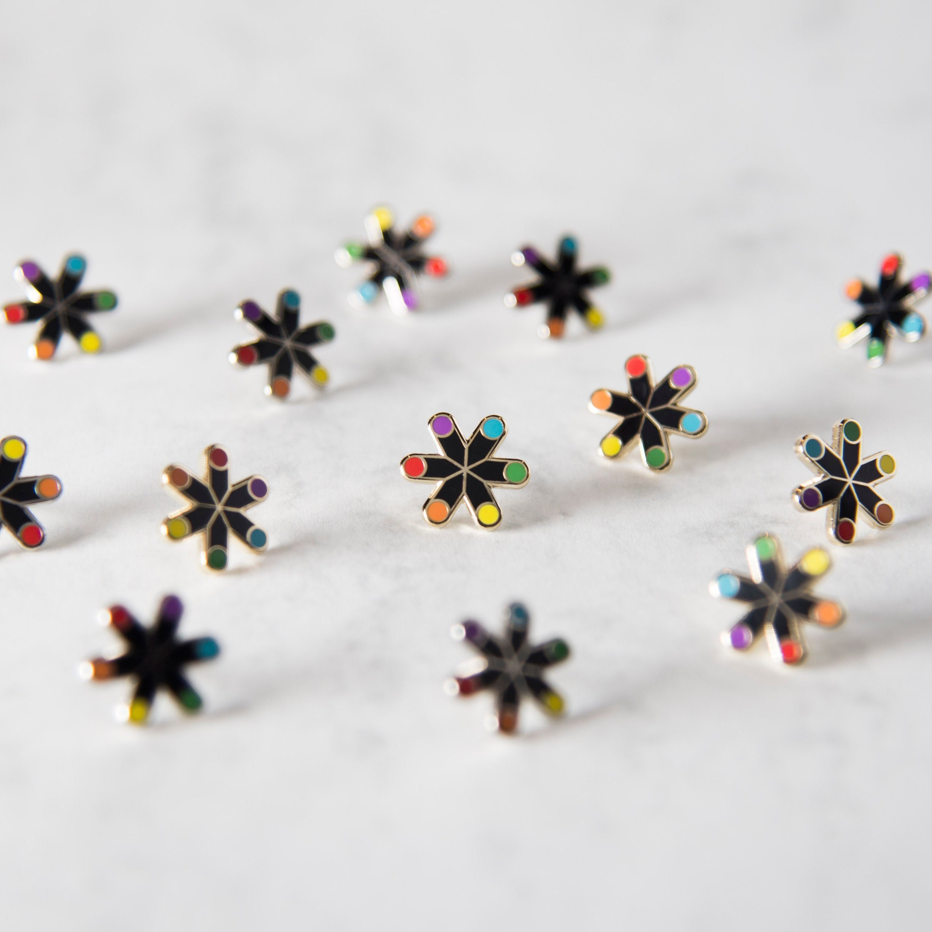 The Rainbow Snowflake Enamel Pin