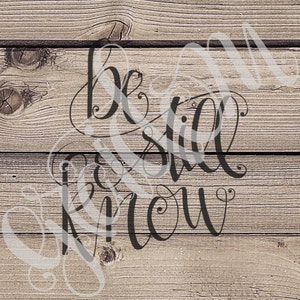 May include: A woodgrain background with the text "Be still and know" written in black cursive script.