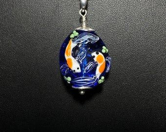 Koi Pond Pendant.  Two Koi Swimming Together on a Blue Background.  Handmade Glass Bead and Sterling Silver Findings. 18" chain.