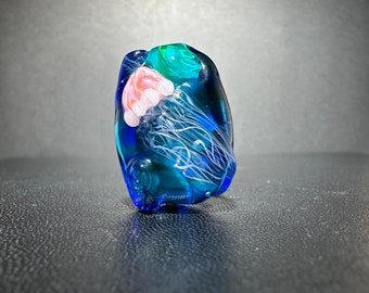 Glass Jelly Fish Bead for Jewelry Makers. Small Organic  Ocean Themed Lampwork bead.  Pink Jelly Fish on a blue and teal background.