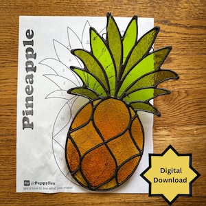 May include: A stained glass pineapple with a yellow and orange body and green leaves. The pineapple is on top of a paper pattern with the word "Pineapple" printed on it. A yellow starburst graphic with the words "Digital Download" is in the lower right corner.
