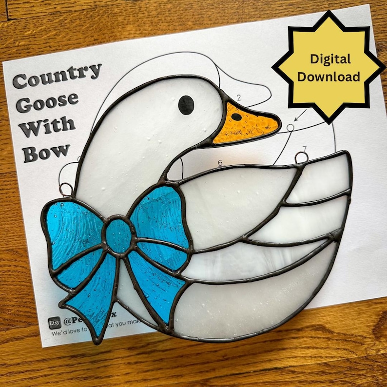 May include: Stained glass goose with a blue bow. The goose is white with a yellow beak and black eye. The design is on a paper with the text "Country Goose With Bow" and a "Digital Download" graphic.
