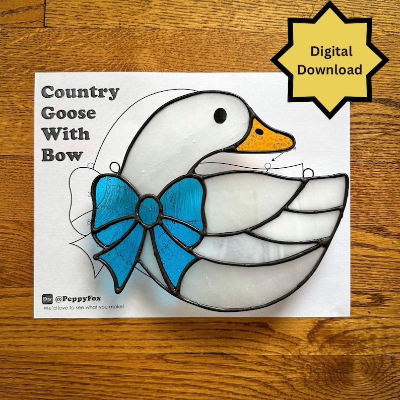 May include: A stained glass pattern of a goose with a blue bow, labelled "Country Goose With Bow." The goose has a white body, a yellow beak, and a black eye. The image also includes a "Digital Download" graphic.