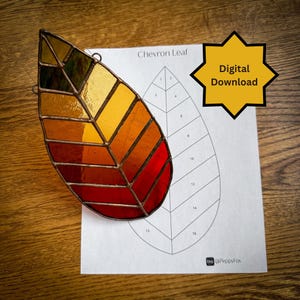 May include: A stained glass leaf pattern with a chevron design. The leaf is made of red, orange, yellow, and green glass. The pattern is numbered 1-16. The image also includes the text "Chevron Leaf" and "Digital Download".