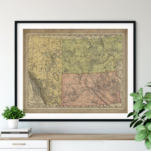 May include: Vintage map of the North West Territories of Canada, showing the provinces of Alberta, Saskatchewan, Manitoba, and British Columbia. The map is printed on aged paper with a cream background and features red, green, and brown lines.