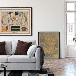 May include: A vintage illustration of a horse and various equestrian equipment, including saddles, bridles, and stirrups. The illustration is framed in a brown wood frame and hangs on a white wall above a white sofa.