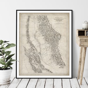 May include: A vintage black and white map of the Gold & Silver Mines District of California. The map shows the location of various mines and towns in the area. The map is titled "Topographical Sketch of the Gold & Silver Mines District, California."