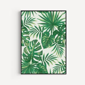 May include: A framed print featuring a tropical leaf pattern with green leaves on a white background.