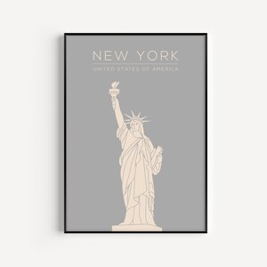 May include: A minimalist line art print of the Statue of Liberty on a grey background. The print features the text "NEW YORK" and "UNITED STATES OF AMERICA".