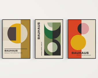 May include: Three Bauhaus-style art prints with geometric shapes in black, white, red, green, yellow, and pink. The prints feature the text "Bauhaus" and the words "Schule für Architektur", "Weimar Dessau Berlin", and "Revolution des Designs".