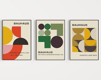 May include: Three Bauhaus art prints with geometric shapes in red, yellow, green, black, and white. The prints have the text "Bauhaus" and the dates "July - October", "Sutterlin Badenerstrasse 109", and "Ausstellung 1923".