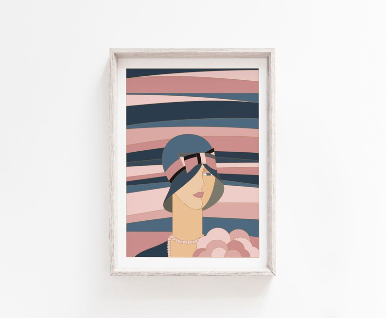 May include: Art print in a wooden frame. The artwork depicts a woman in a blue cloche hat with a pink ribbon, set against a backdrop of pink and blue horizontal stripes. The woman wears a pearl necklace and holds a bouquet. The style is geometric and stylized.