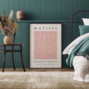 May include: A pink and white art print with a line drawing of a tree and the text "MATISSE MUS&Eacute;E D'ORSAY Rue de la L&eacute;gion d'honneur".