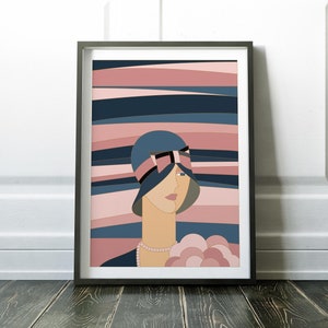 May include: Art print in a black frame, depicting a woman in a blue hat with a black bow and a pearl necklace. The background features horizontal stripes in blue and pink. The artwork is a stylish illustration.