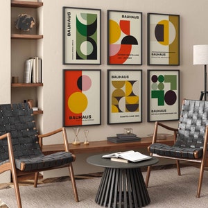 May include: A set of six Bauhaus-style posters with geometric shapes in red, yellow, green, and black. The posters feature the text "BAUHAUS" and various dates and locations.