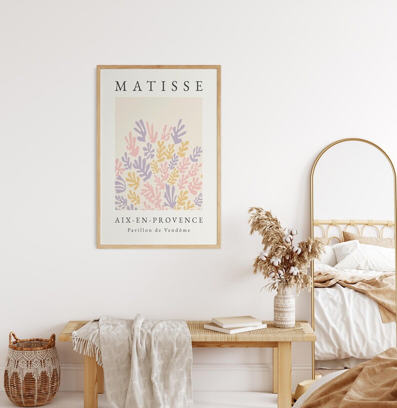 May include: A framed print of a Matisse painting featuring a colorful abstract design of leaves in shades of pink, purple, and yellow. The print is titled "Matisse" and includes the text "Aix-en-Provence, Pavillon de Vend&ocirc;me".