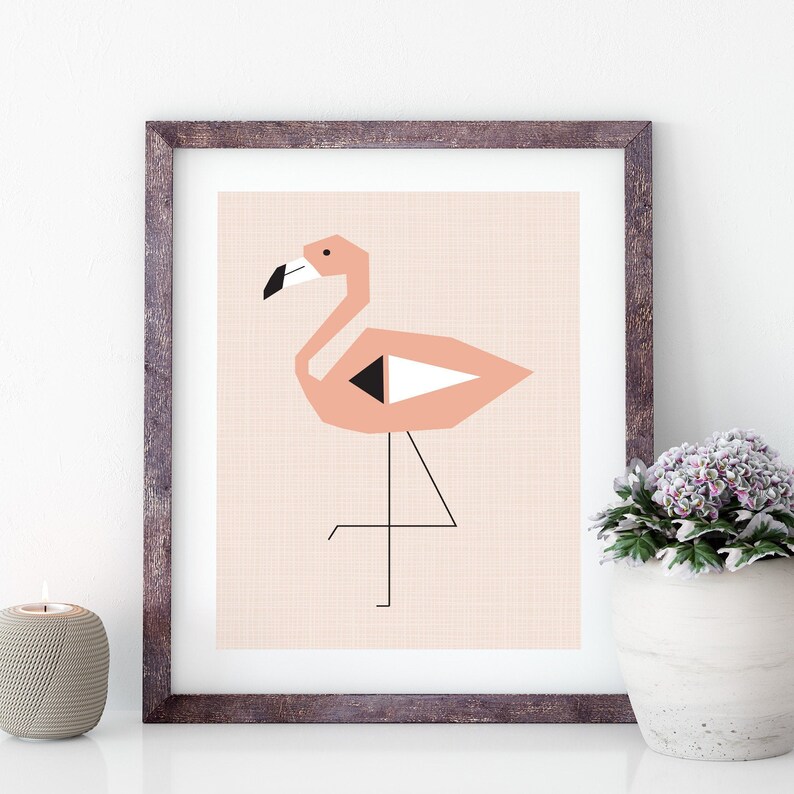 May include: A framed print of a pink flamingo with black and white geometric details. The flamingo is standing on one leg with its head turned to the side. The background is a light pink.