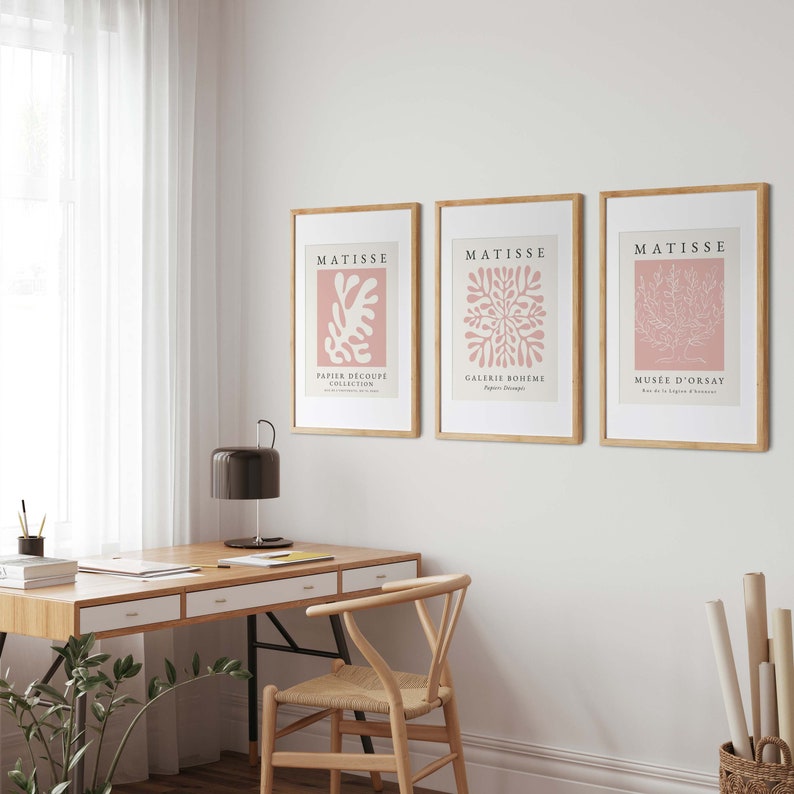 May include: Three framed art prints with pink backgrounds and white cut-out designs. The prints are titled "Matisse" and feature the text "Papier Decoupe Collection", "Galerie Boheme", and "Musee D'Orsay".