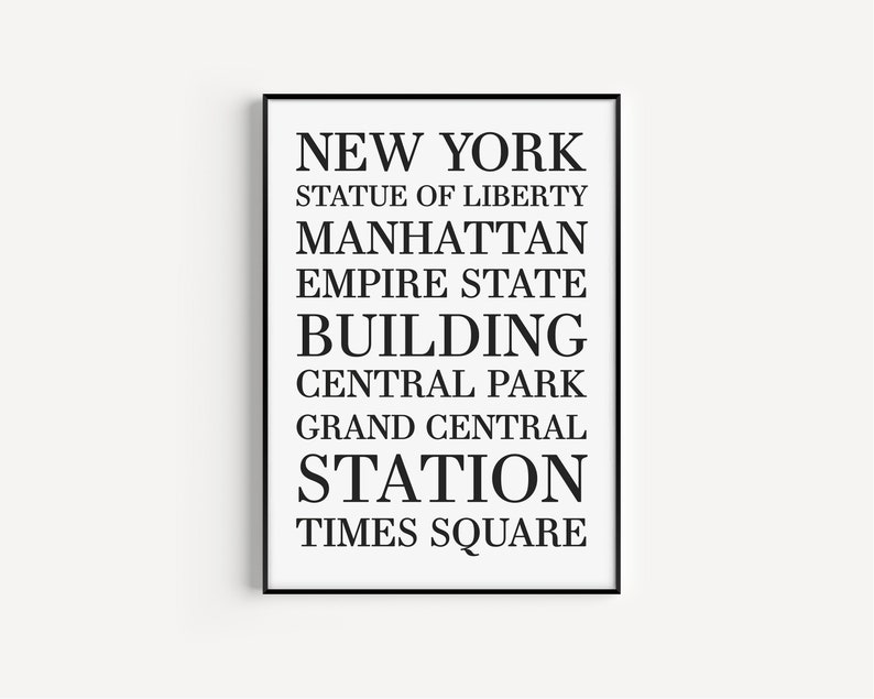 May include: Black and white typography print with the text "NEW YORK", "STATUE OF LIBERTY", "MANHATTAN", "EMPIRE STATE BUILDING", "CENTRAL PARK", "GRAND CENTRAL STATION", and "TIMES SQUARE".