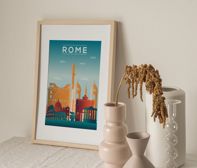 May include: A framed print with a cityscape of Rome, Italy. The print is on a white background with a blue gradient sky. The buildings are in shades of orange, red, and yellow. The word "ROME" is printed in white at the top of the print.