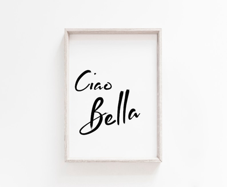 May include: A framed print with the text "Ciao Bella" in black script font on a white background.