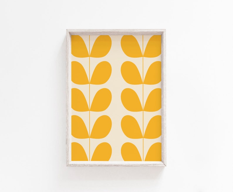 May include: A framed print with a repeating pattern of yellow leaf shapes on a cream background.