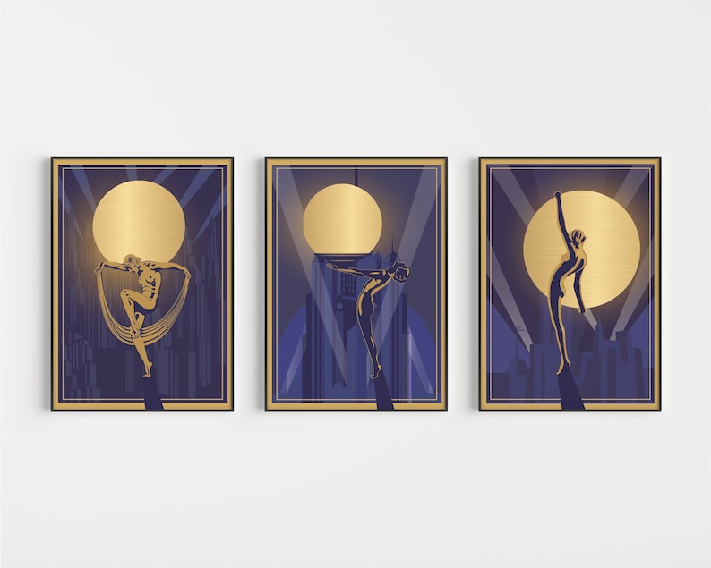 May include: Three gold framed prints with a dark blue background. Each print features a gold silhouette of a woman in a dynamic pose against a large gold circle. The silhouettes are set against a cityscape with a spotlight effect.