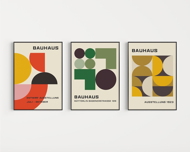 May include: Three Bauhaus art prints with geometric shapes in red, yellow, green, black, and white. The prints have the text "Bauhaus" and the dates "July - October", "Sutterlin Badenerstrasse 109", and "Ausstellung 1923".