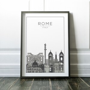 May include: A black and white framed print of the Rome skyline with the text "ROME ITALY" at the top.