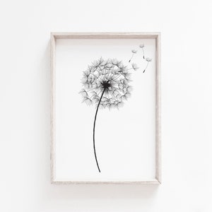 May include: Black and white line art print of a dandelion with seeds blowing in the wind. The print is framed in a light wood frame.