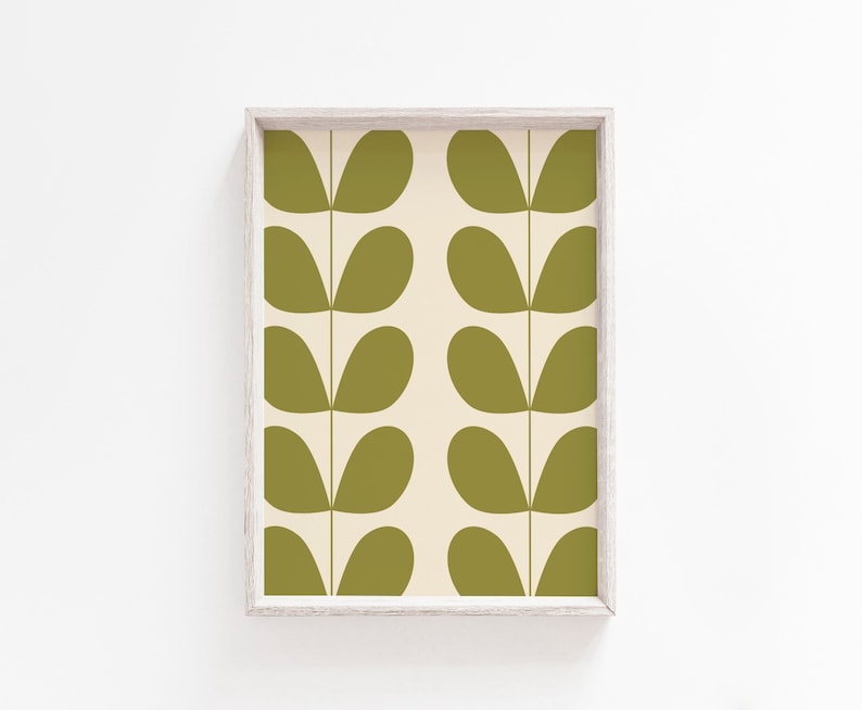 May include: A framed print with a repeating pattern of green leaf shapes on a cream background.