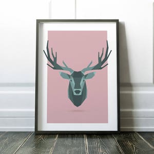 May include: A framed print of a geometric deer head design in shades of teal and gray on a pink background.