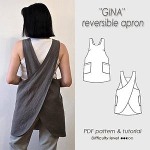 May include: A dark gray reversible apron with a cross-back design and two side pockets. The image includes text reading GINA reversible apron and PDF pattern & tutorial, along with two black and white line drawings showing the front and back views.